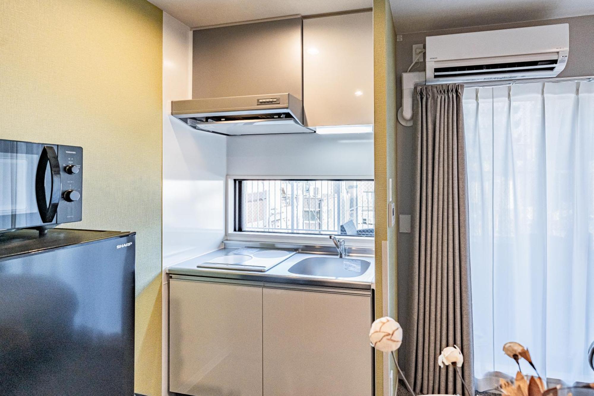Apartment Hotel 11 Umeda Kamiyama أوساكا المظهر الخارجي الصورة